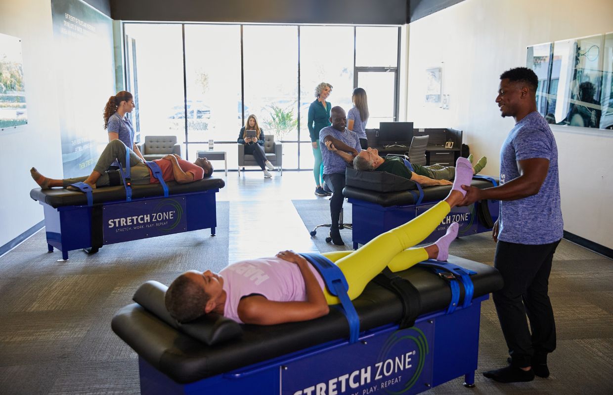 Multiple clients being stretched at a Stretch Zone studio